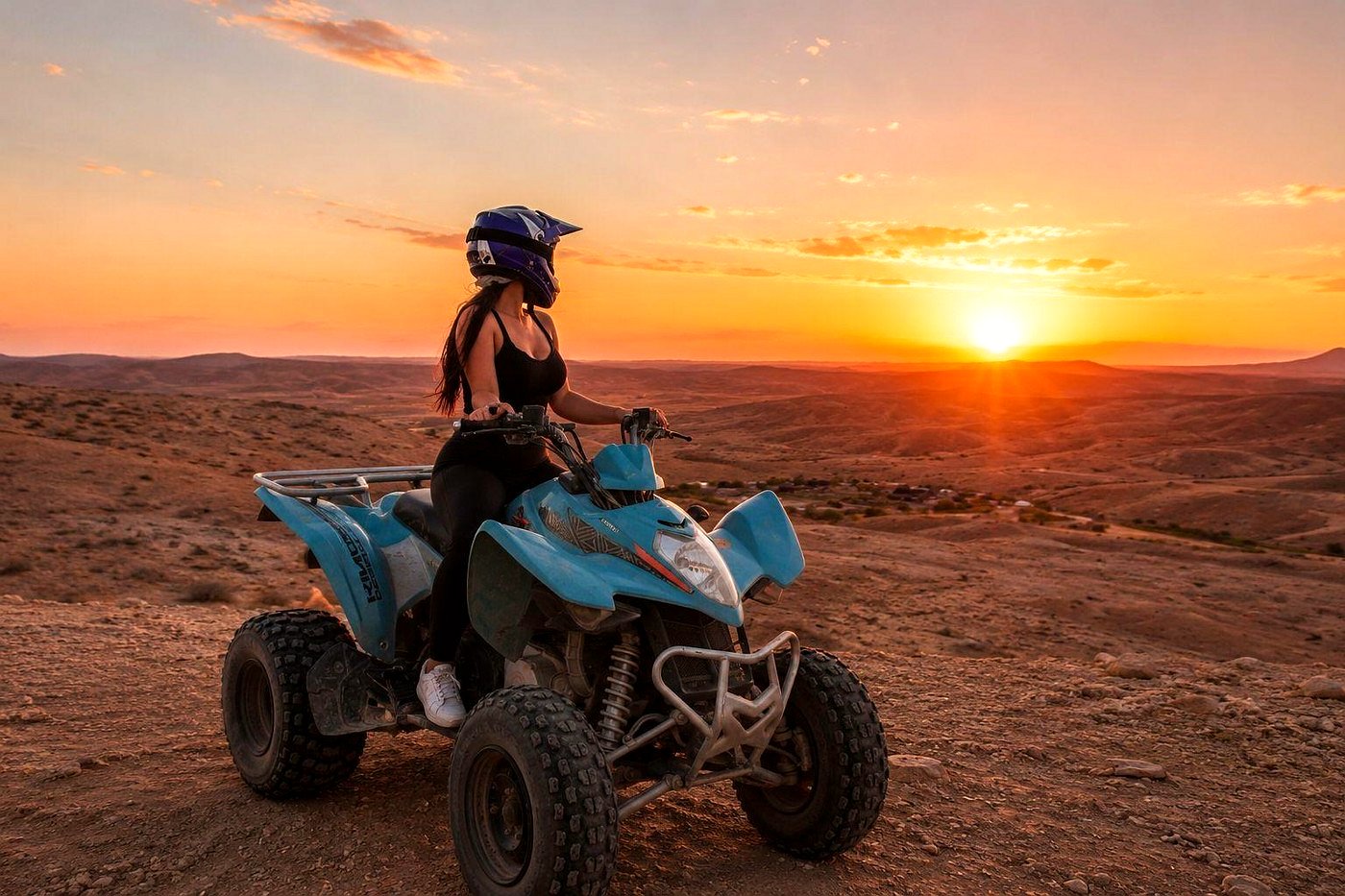 Quad bike rider in the Agafay desert at sunset