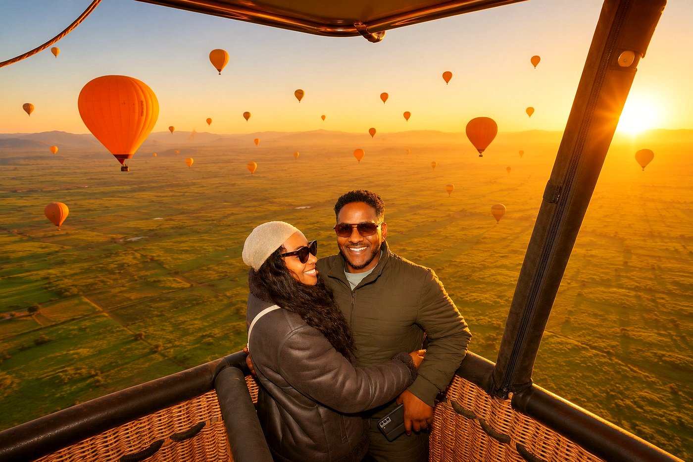 Couple in a balloon basket with balloons in the sunrise sky