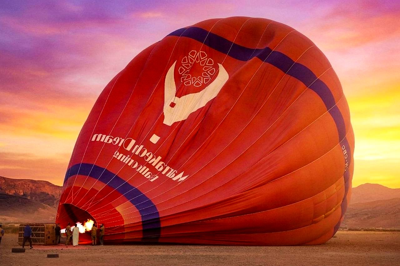 Hot air balloon being inflated at dawn near Marrakech
